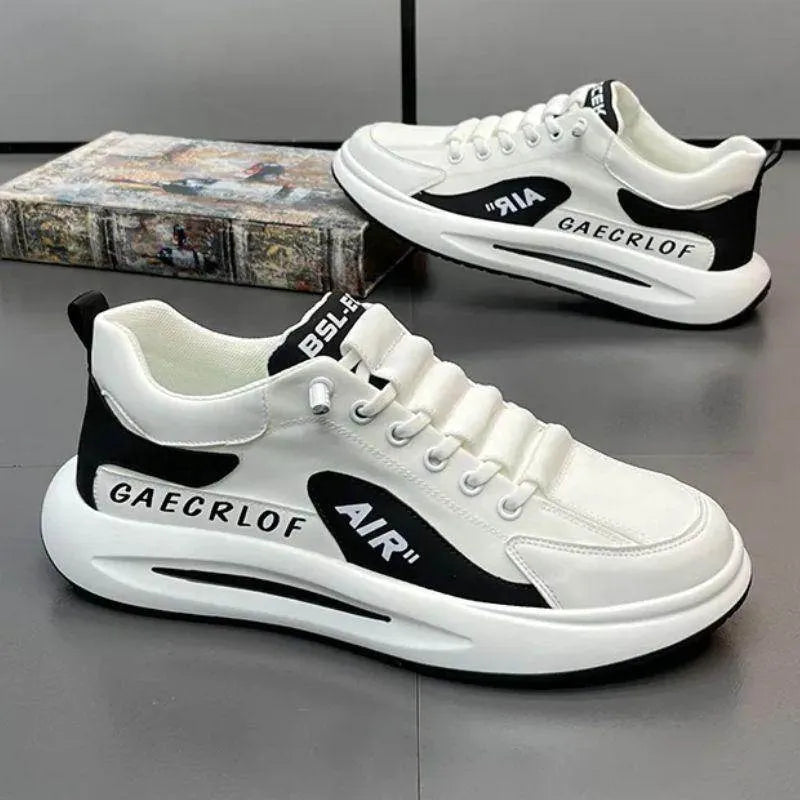 White sneakers with black accents on a gray surface