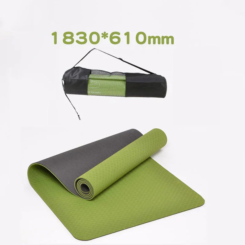 Green and gray yoga mat with carrying strap on a white background