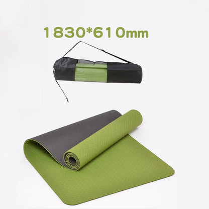 Green and gray yoga mat with carrying strap on a white background