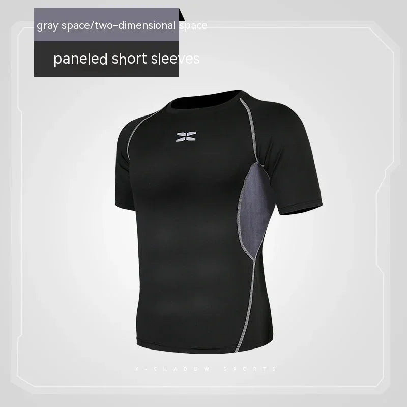 Black athletic shirt with gray panels on a light gray background