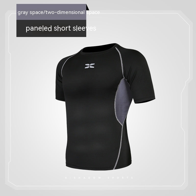 Black athletic shirt with gray panels on a light gray background