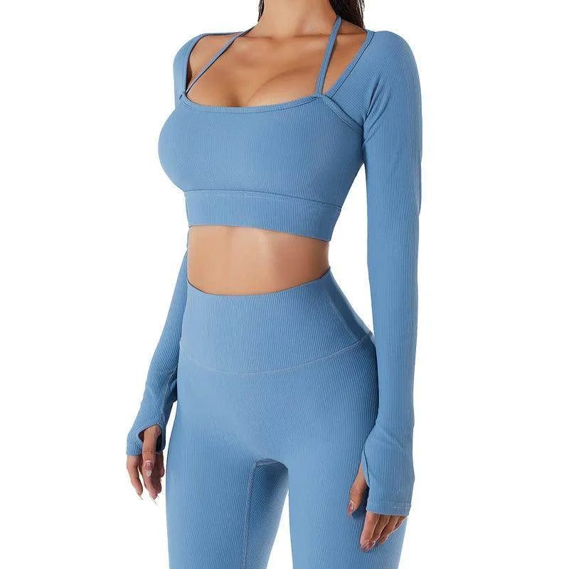 Blue athletic outfit with long-sleeve top and leggings on a white background