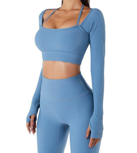 Blue athletic outfit with long-sleeve top and leggings on a white background