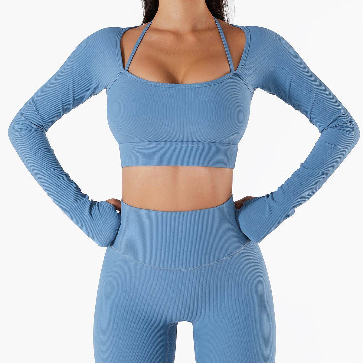 Blue athletic outfit with long-sleeve top and leggings on a white background