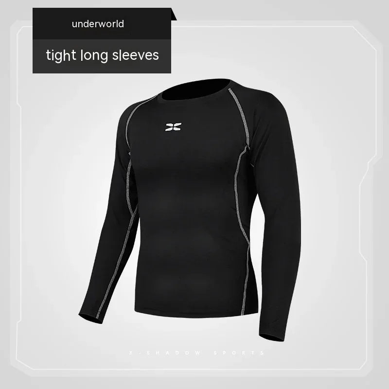 Black long-sleeve athletic shirt with gray accents on a light gray background, featuring the 'underworld' brand.