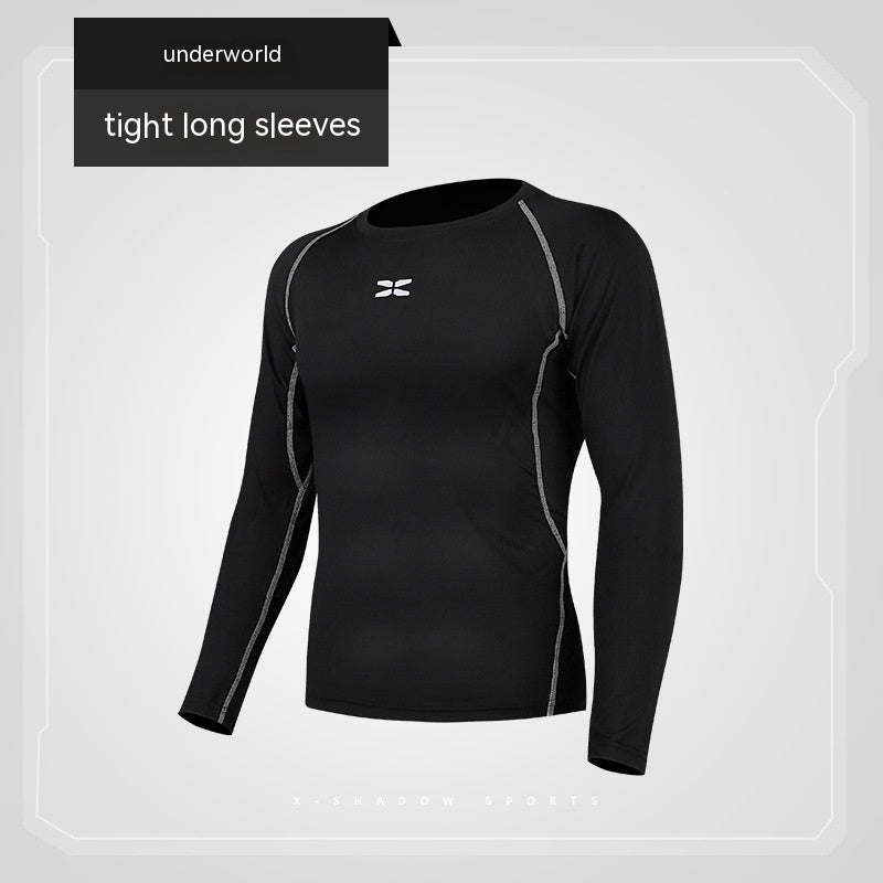 Black long-sleeve athletic shirt with gray accents on a light gray background, featuring the 'underworld' brand.