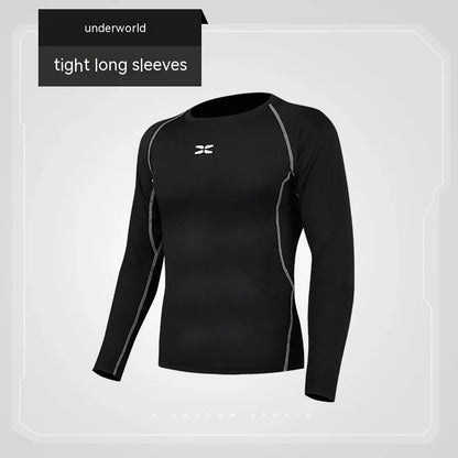 Black long-sleeve athletic shirt with gray accents on a light gray background, featuring the 'underworld' brand.