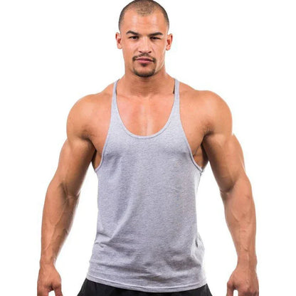 Man wearing a gray tank top on a white background