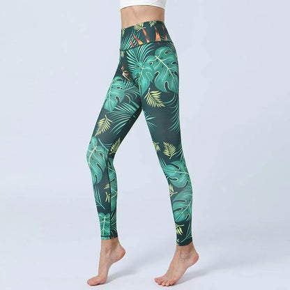 Green leaf-patterned leggings on a white background