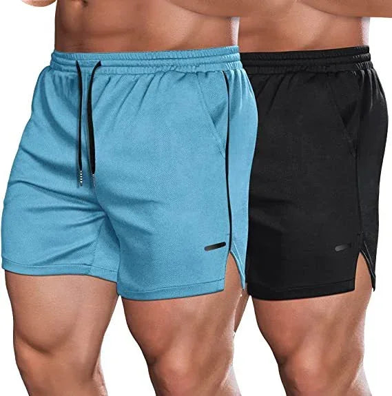 Two pairs of shorts, one blue and one black, on a plain background.
