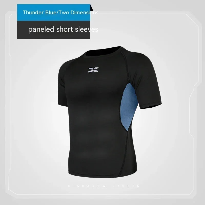 Black athletic shirt with blue panel on sleeves against a gray background