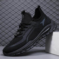 Black athletic shoe on a gray background