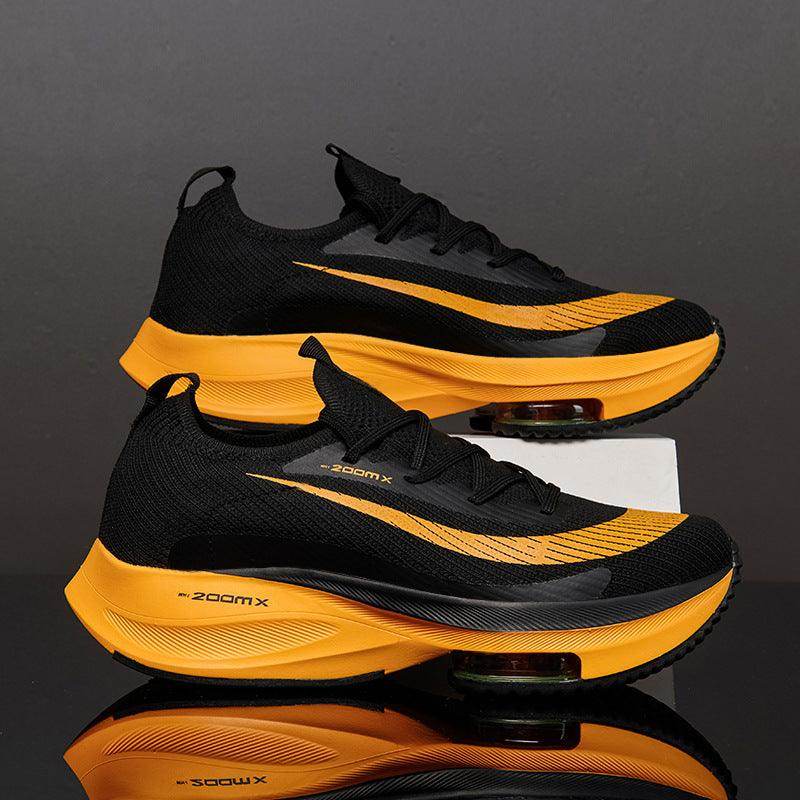 Black and yellow running shoes with 'zoomx' branding on a reflective surface.