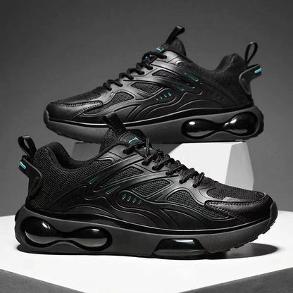 Black athletic shoes with air bubble design on a gray background