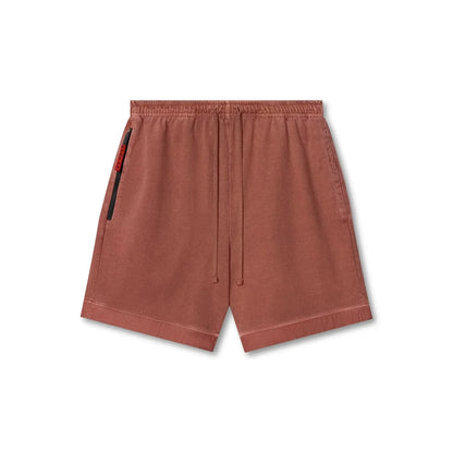 Brown shorts with a side pocket on a white background