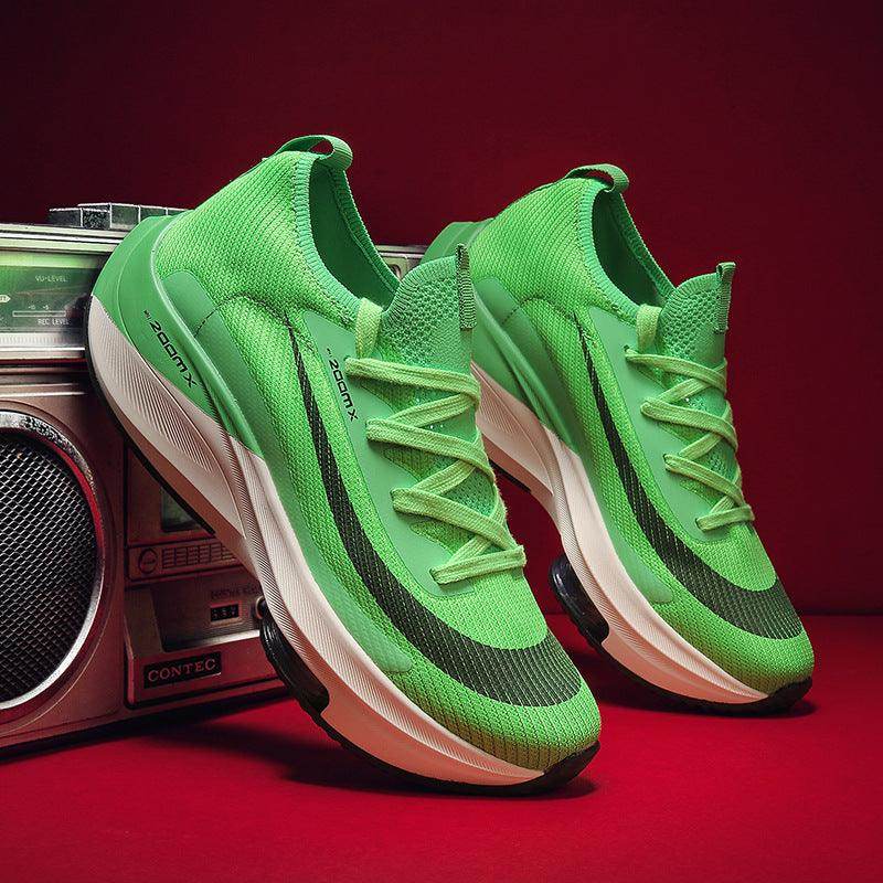 Green running shoes with white soles on a red background