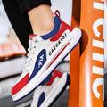 White, red, and blue sneakers with 'GAECRLOF' branding against an orange background.
