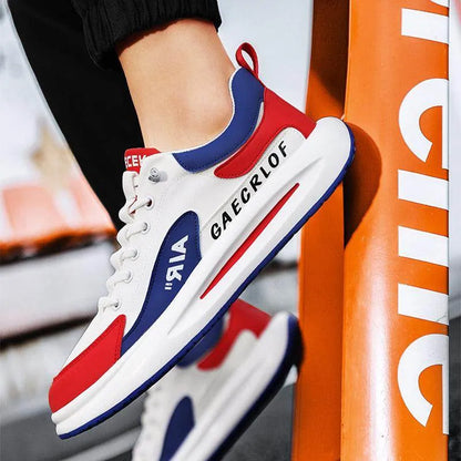 White, red, and blue sneakers with 'GAECRLOF' branding against an orange background.